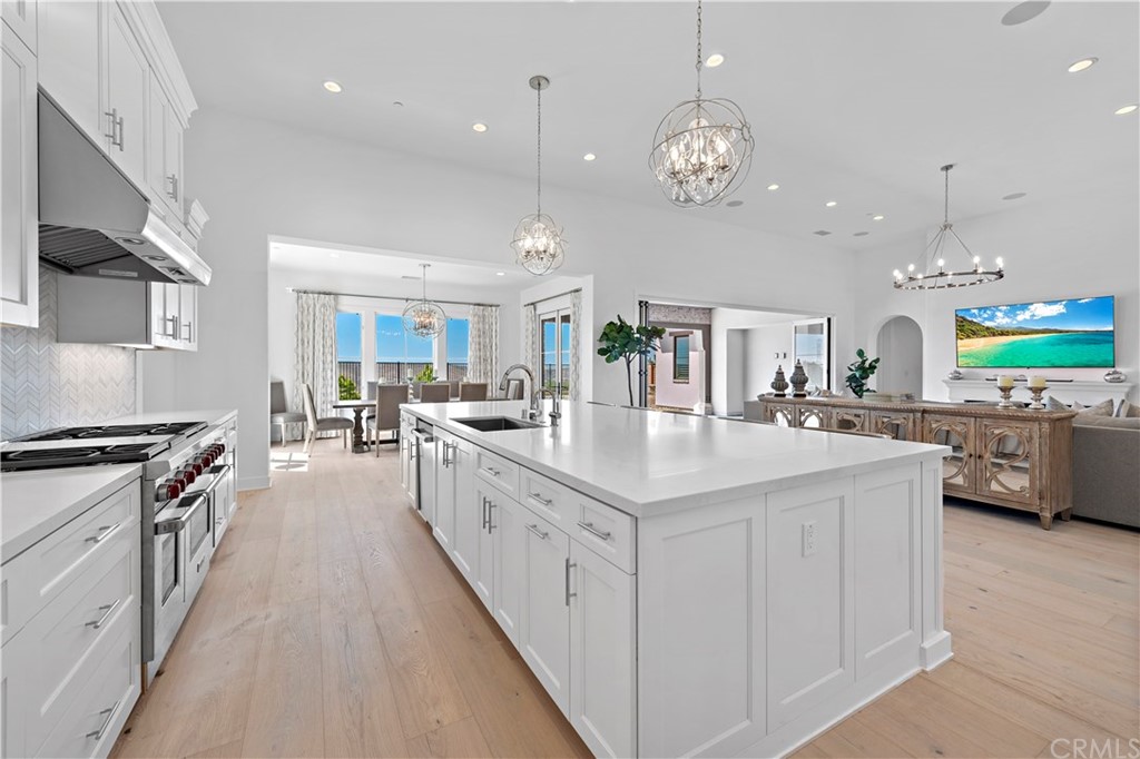 9 Catalina Vista Road Ladera Ranch, CA 92694 - Photo 34 of 41 a large white kitchen with lots of counter space and stainless steel appliances