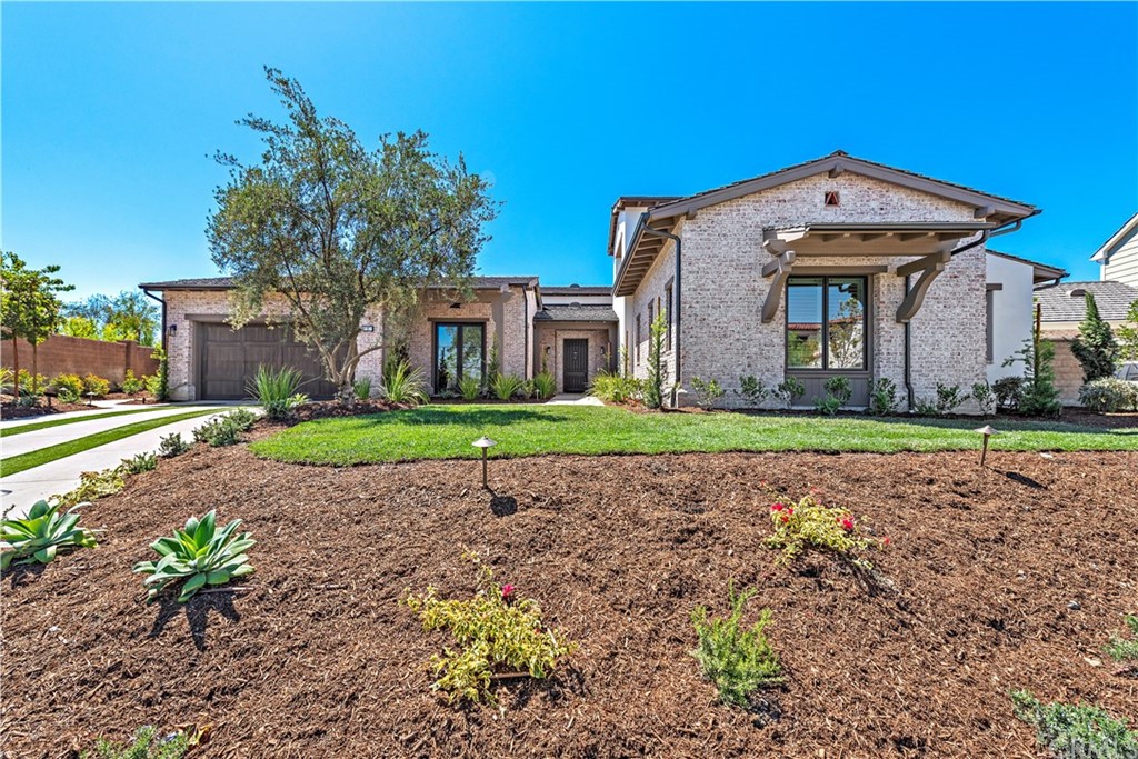 9 Catalina Vista Road Ladera Ranch, CA 92694 - Photo 37 of 41 a front view of a house with a garden