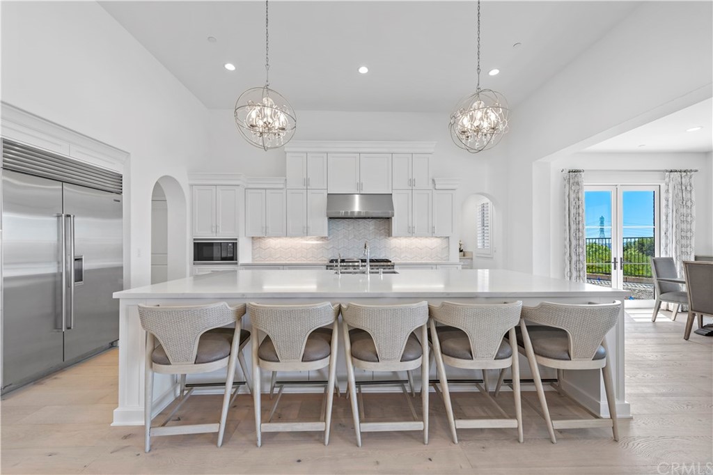 9 Catalina Vista Road Ladera Ranch, CA 92694 - Photo 6 of 41 a large kitchen with a table and chairs
