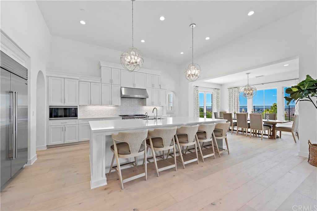 9 Catalina Vista Road Ladera Ranch, CA 92694 - Photo 9 of 41 a large kitchen with a table and chairs