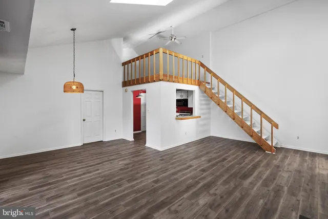 a view of an entryway with wooden floor