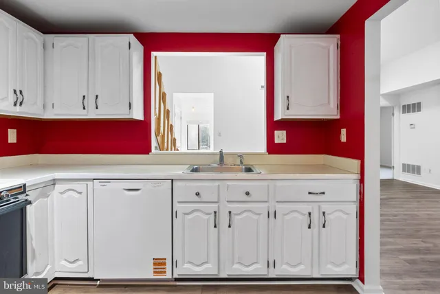 a bathroom with a sink vanity and mirror