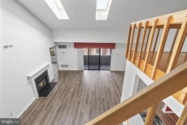 a view of a livingroom with furniture and a fireplace