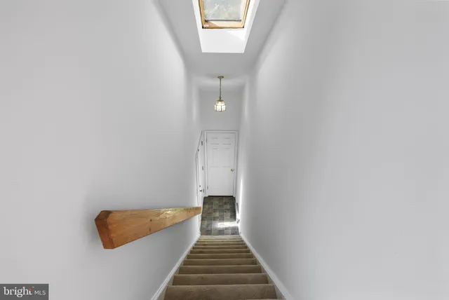 a view of a hallway with staircase