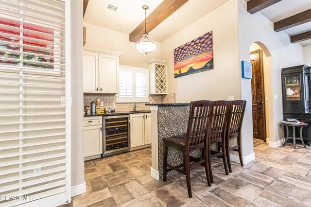 a kitchen with stainless steel appliances granite countertop a sink and a counter