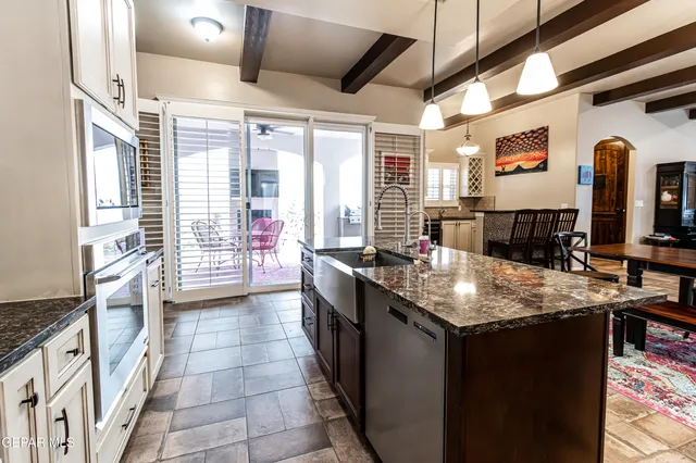 a kitchen with counter top space and appliances