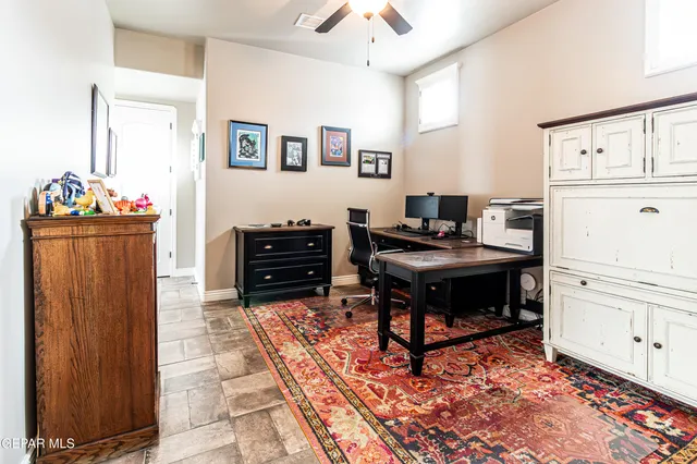 a bedroom with furniture and a chair