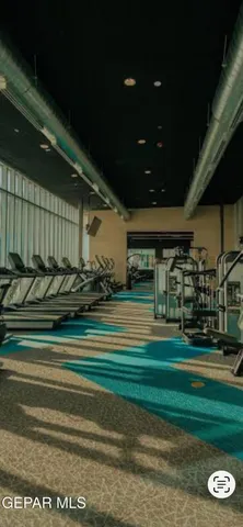 a view of a chairs and table in a patio