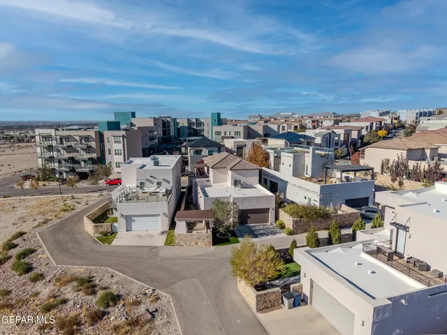 an aerial view of a house with a patio