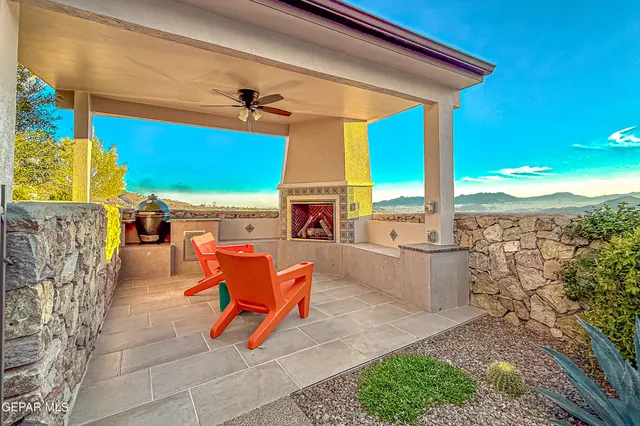 a building outdoor space with patio furniture and potted plants