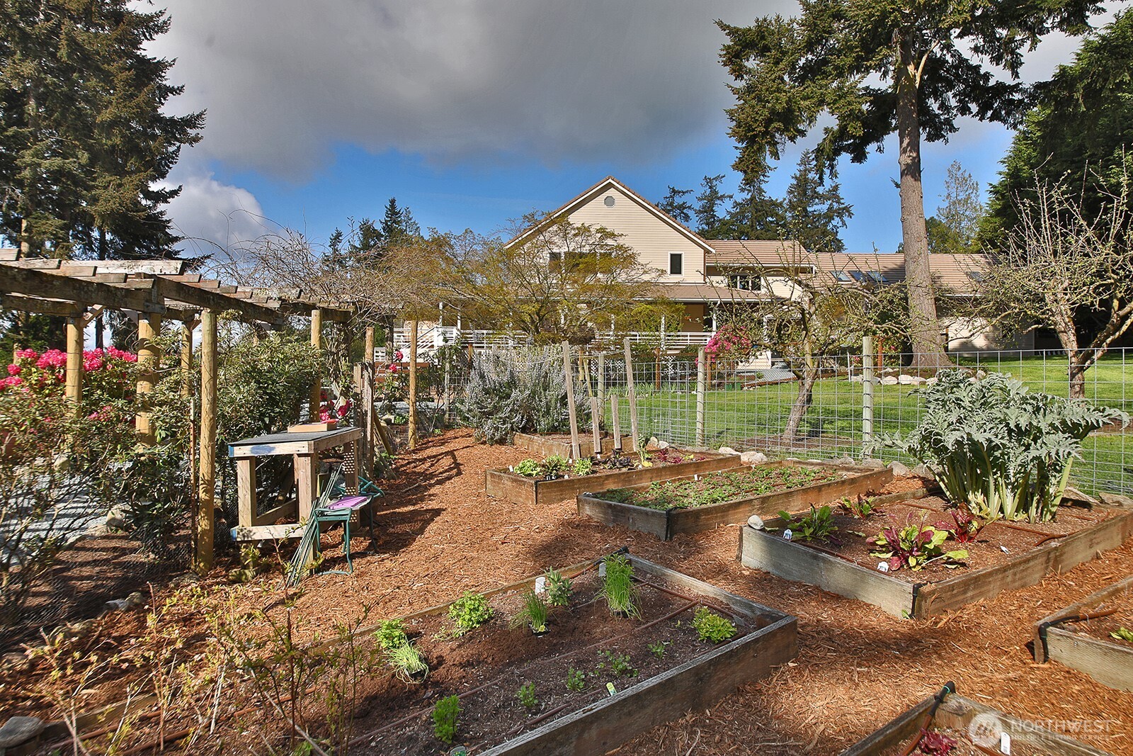 5741 Crow Haven Road Langley, WA 98260 - Photo 15 of 40 a view of a house with backyard and sitting area