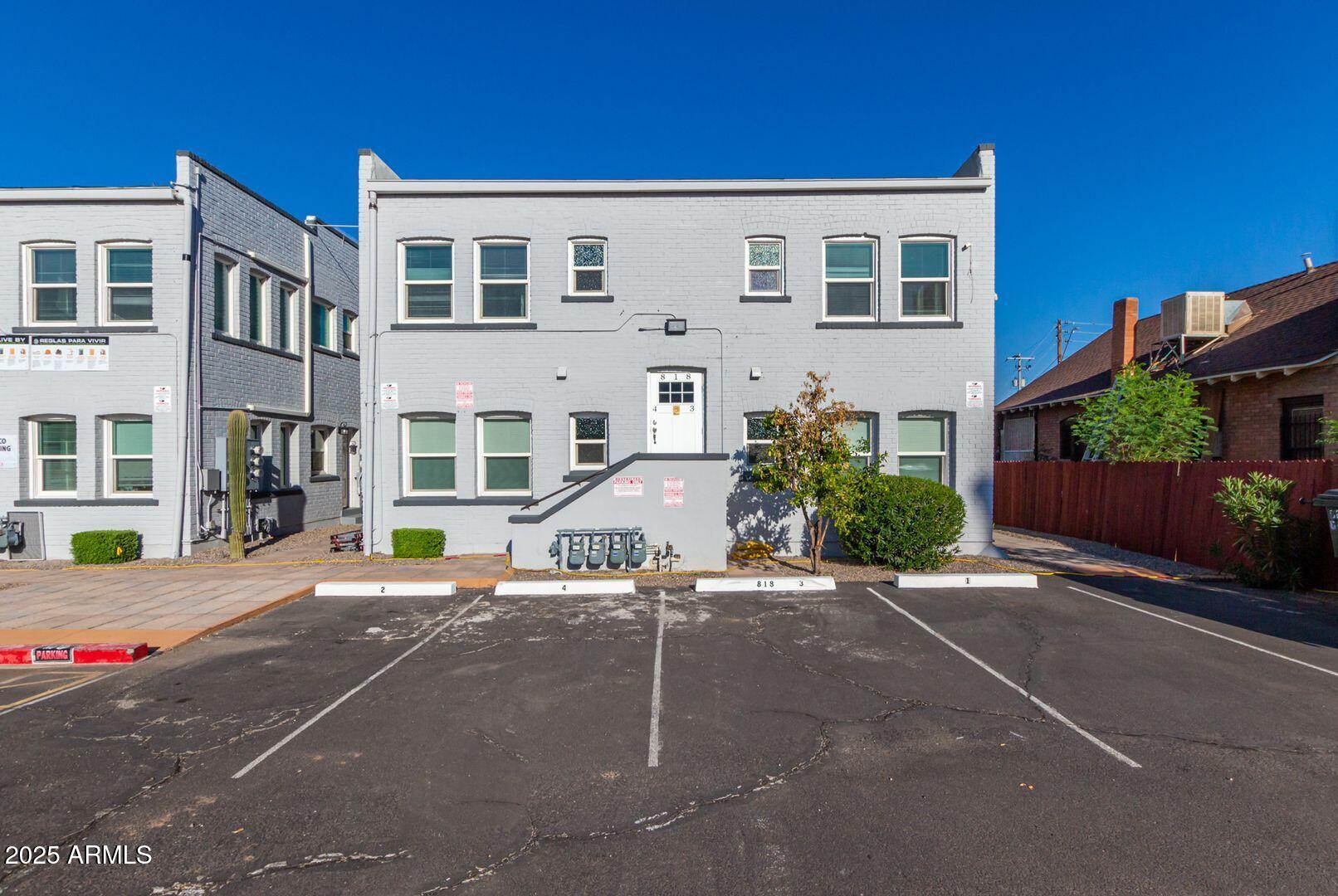 822 North 7th Street, Unit 2 Phoenix, AZ 85004 - Photo 18 of 18 a view of a white house with a yard