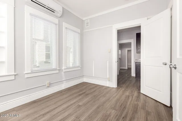a view of wooden floor and windows in a room