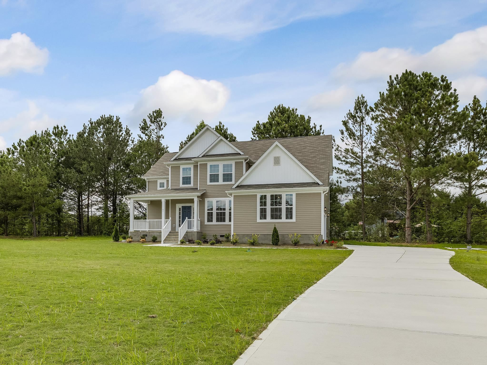 41 Two Belles Court, Unit BG 2 Angier, NC 27501 - Photo 1 of 3 a front view of house with yard and green space