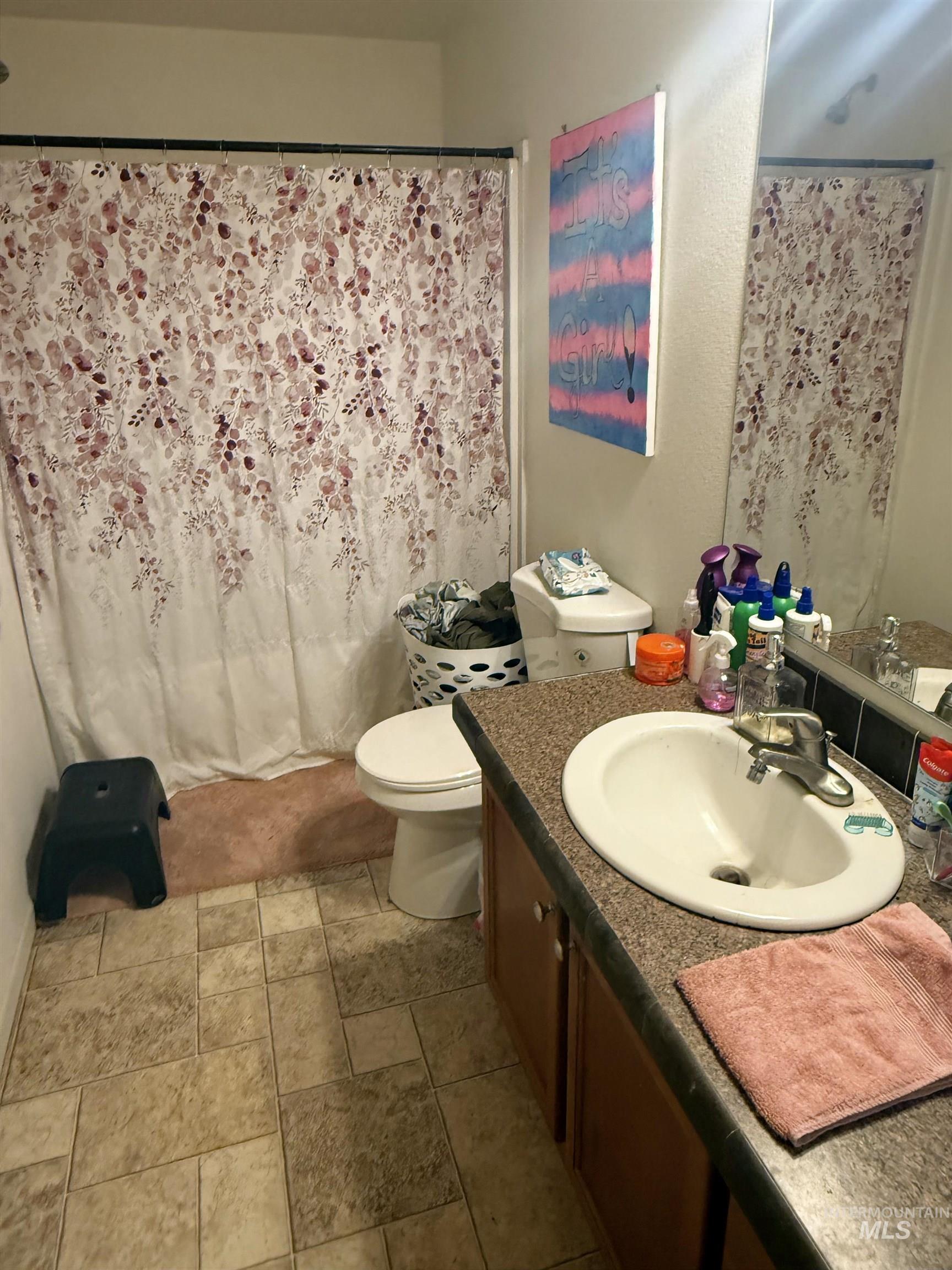 100 Ellsworth Street Vale, OR 97918 - Photo 6 of 25 Bathroom featuring a vanity with a laminate countertop, integrated sink, and chrome faucet