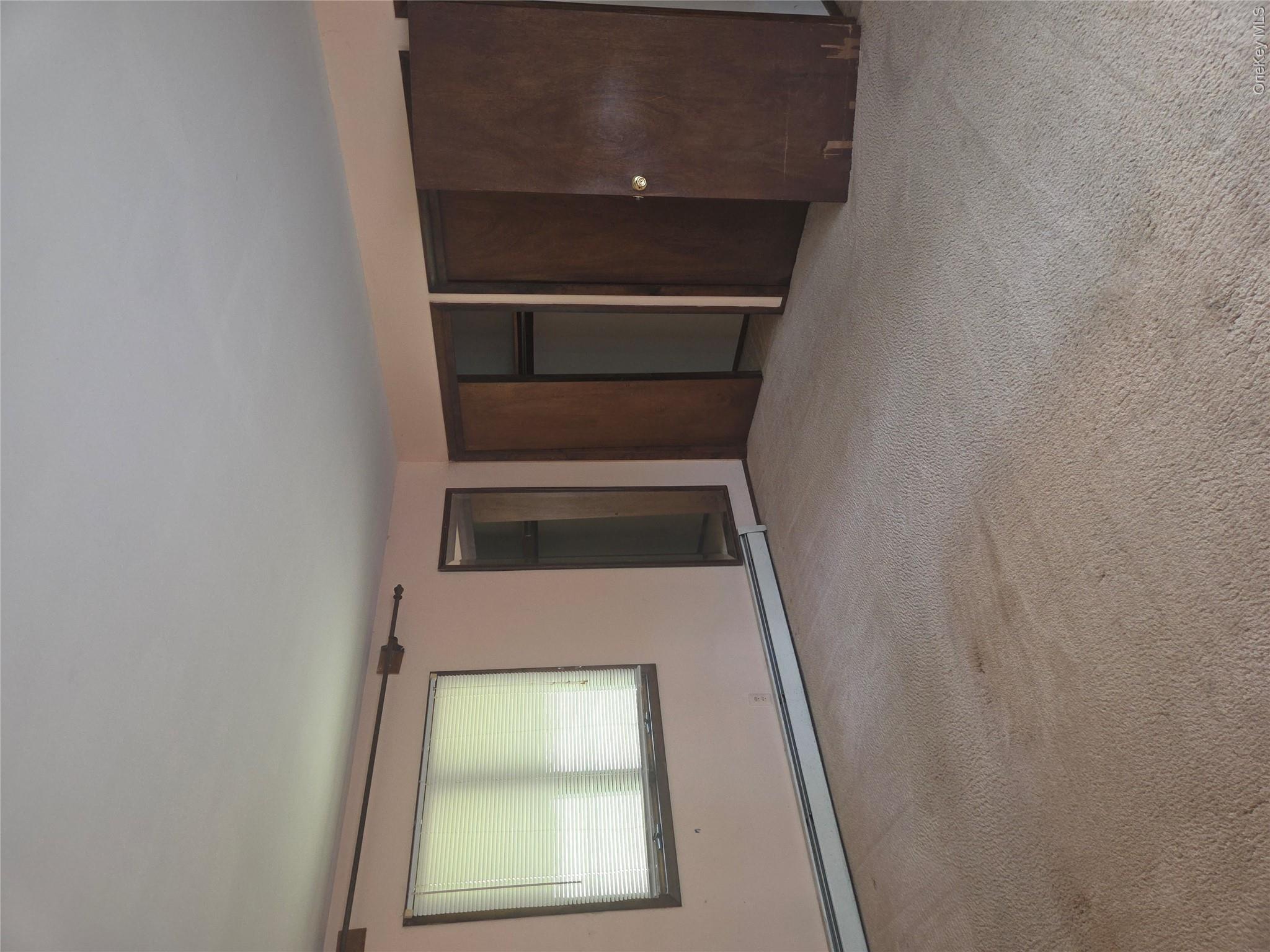 63 Otens Road Ellenville, NY 12428 - Photo 20 of 32 an empty room with a empty space and windows