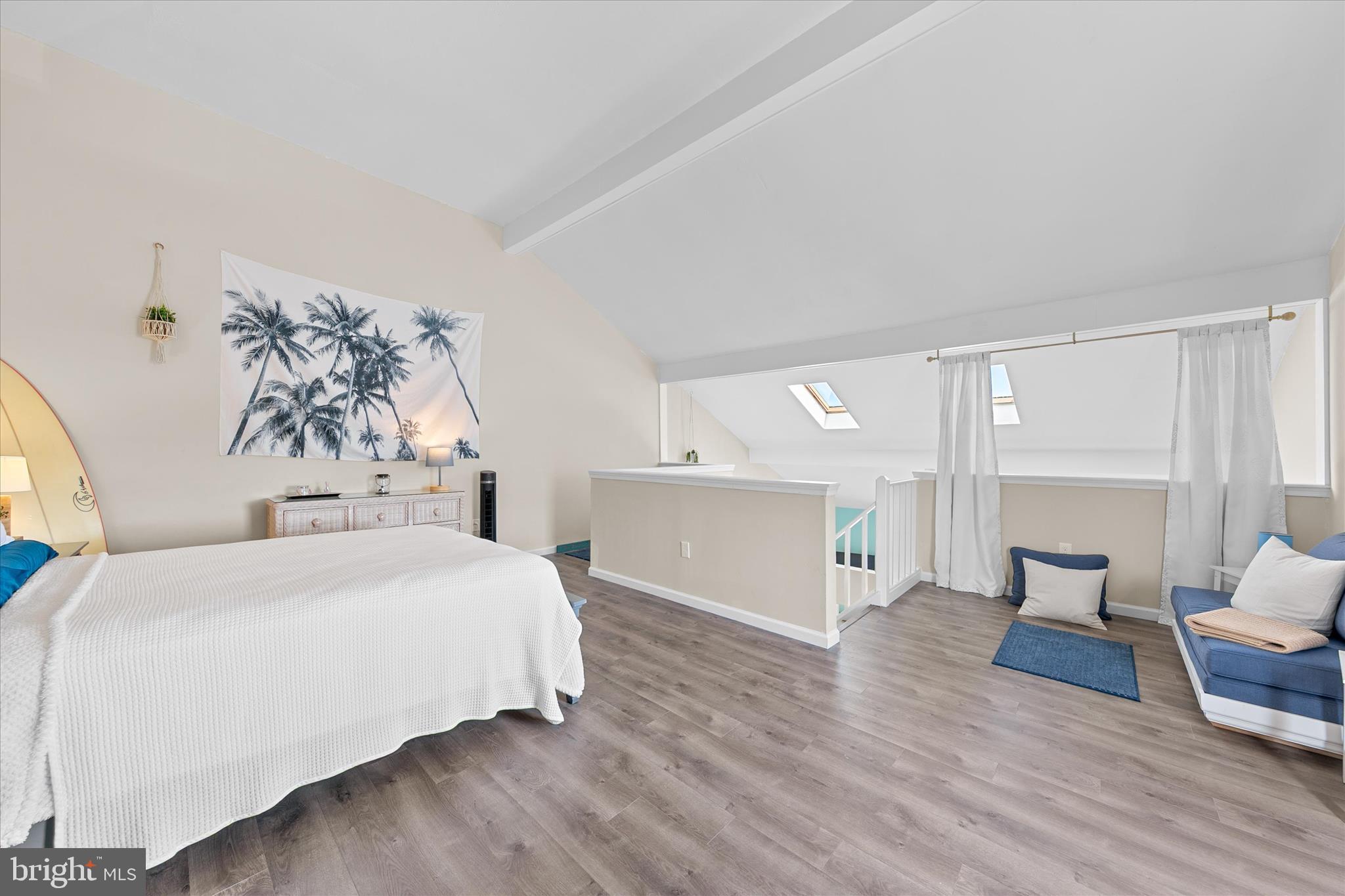 132 Jamestown Road, Unit 601 Ocean City, MD 21842 - Photo 16 of 37 a spacious bedroom with a bed and a table