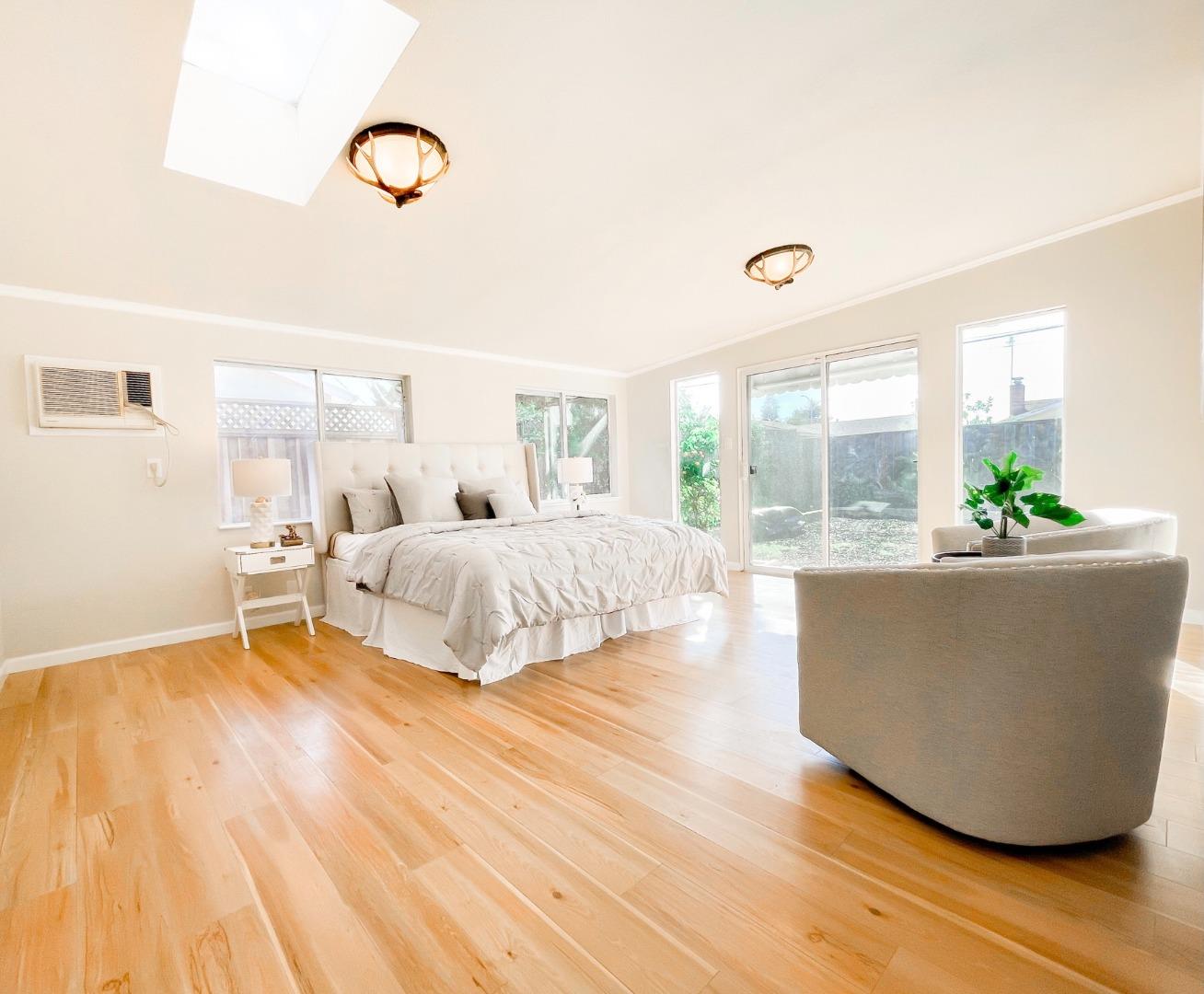 4447 Sloat Road Fremont, CA 94538 - Photo 16 of 28 a living room with a bed furniture and next to a window