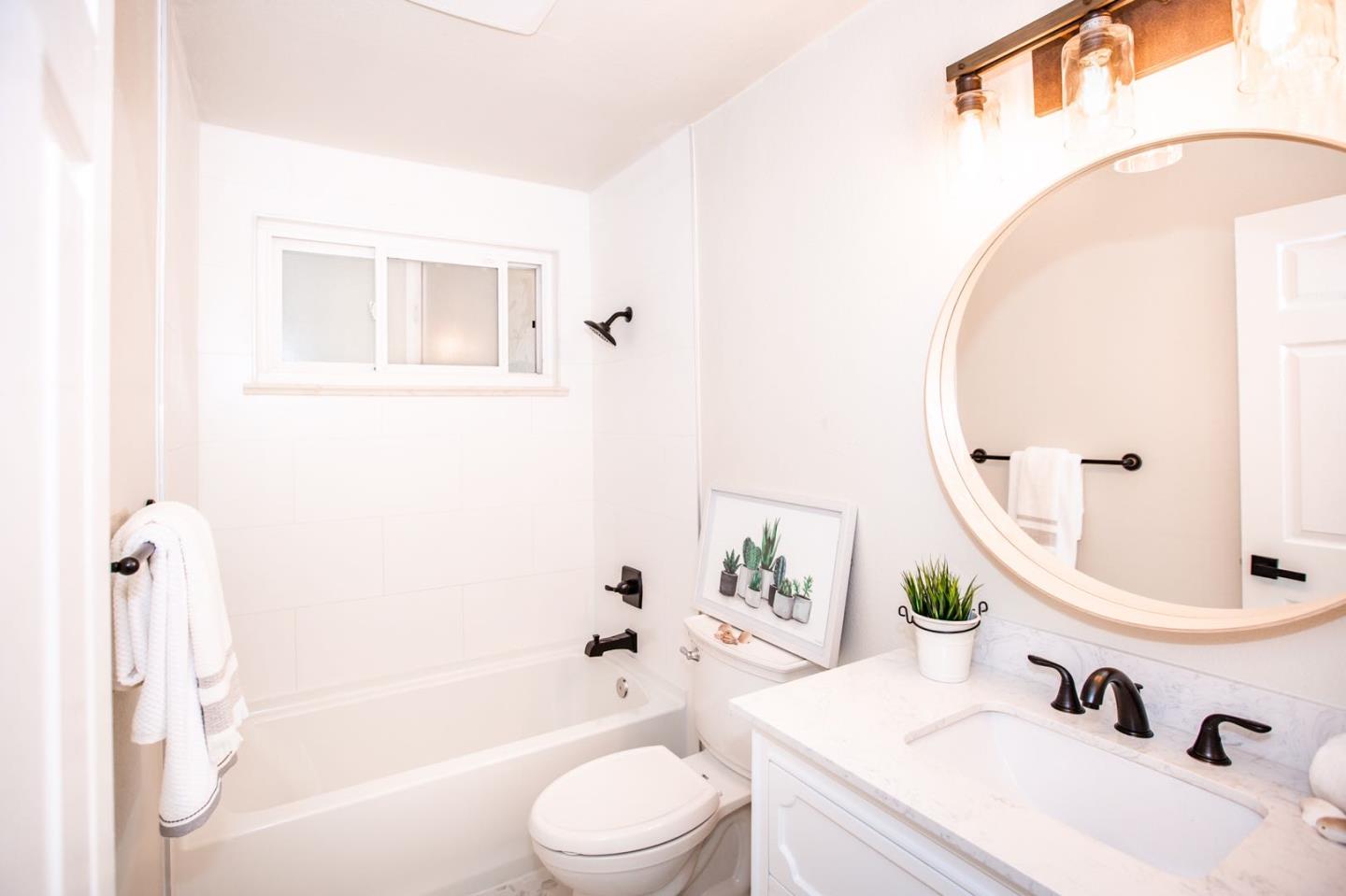 4447 Sloat Road Fremont, CA 94538 - Photo 20 of 28 a bathroom with a sink toilet and shower
