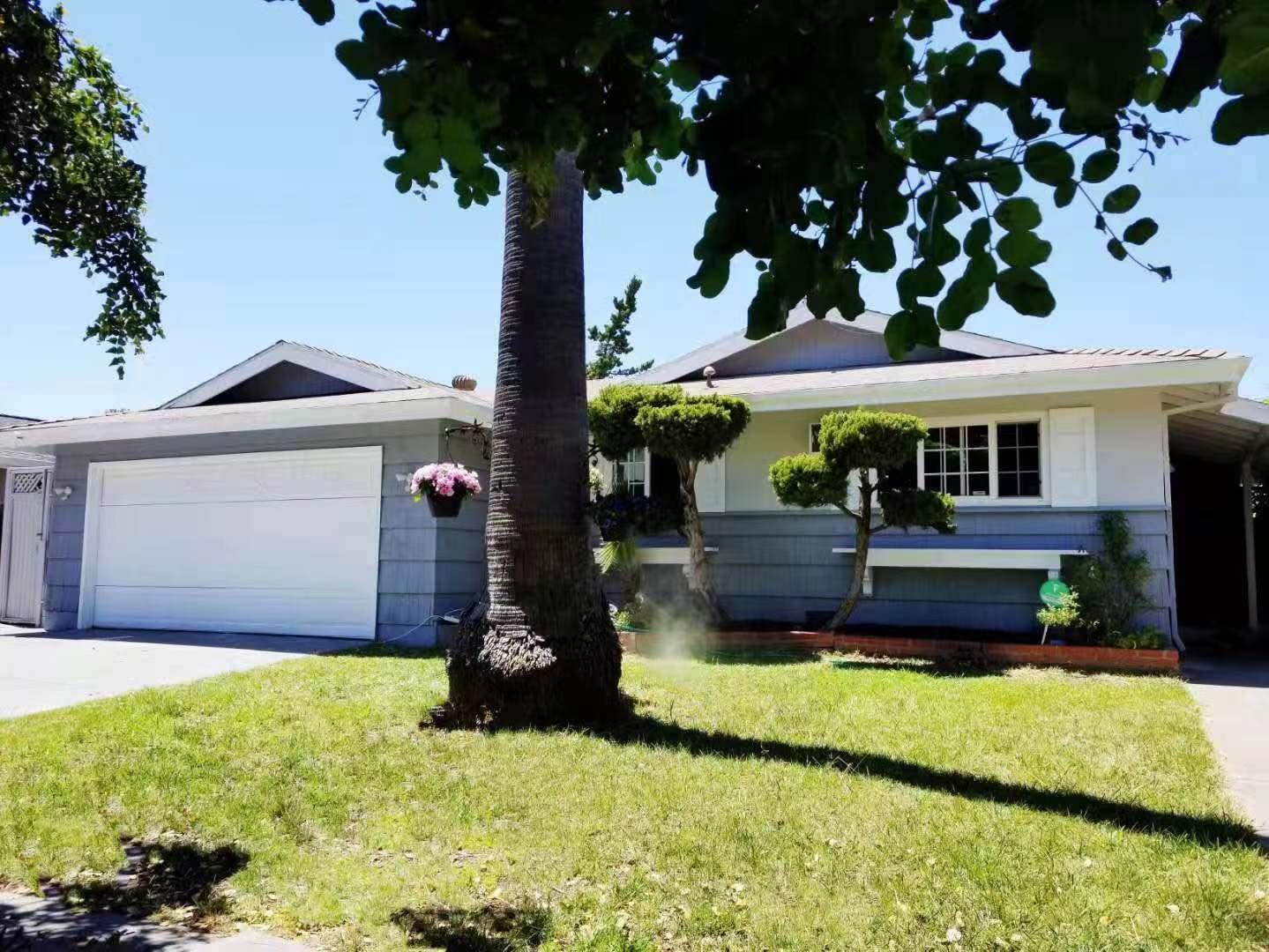 4447 Sloat Road Fremont, CA 94538 - Photo 2 of 28 a front view of a house with a yard table and chairs