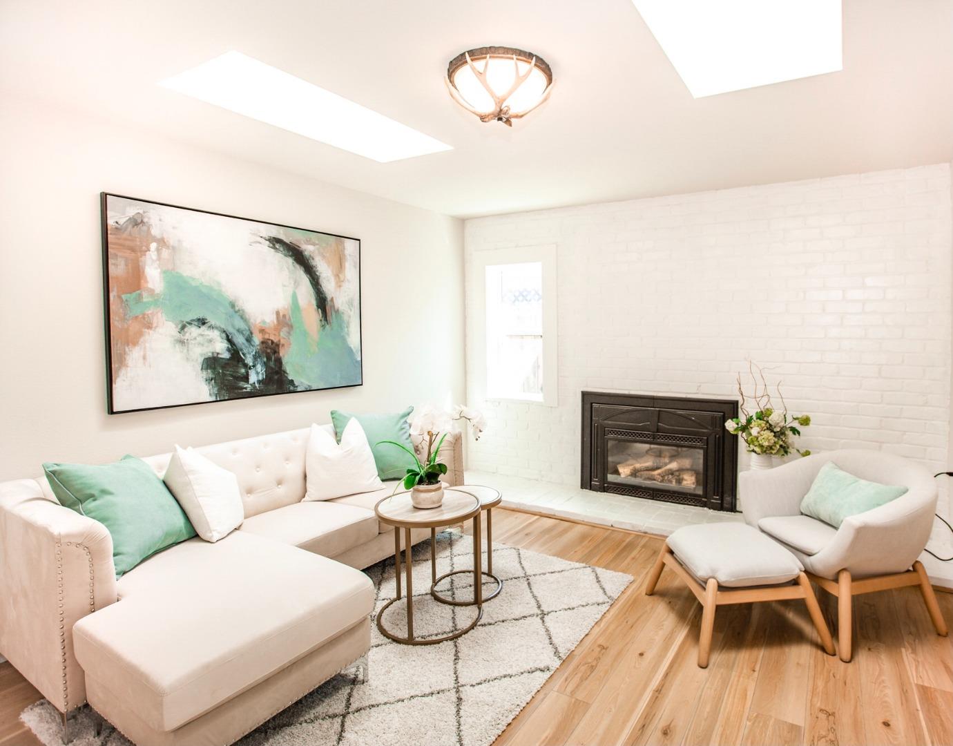 4447 Sloat Road Fremont, CA 94538 - Photo 8 of 28 a living room with furniture and a fireplace