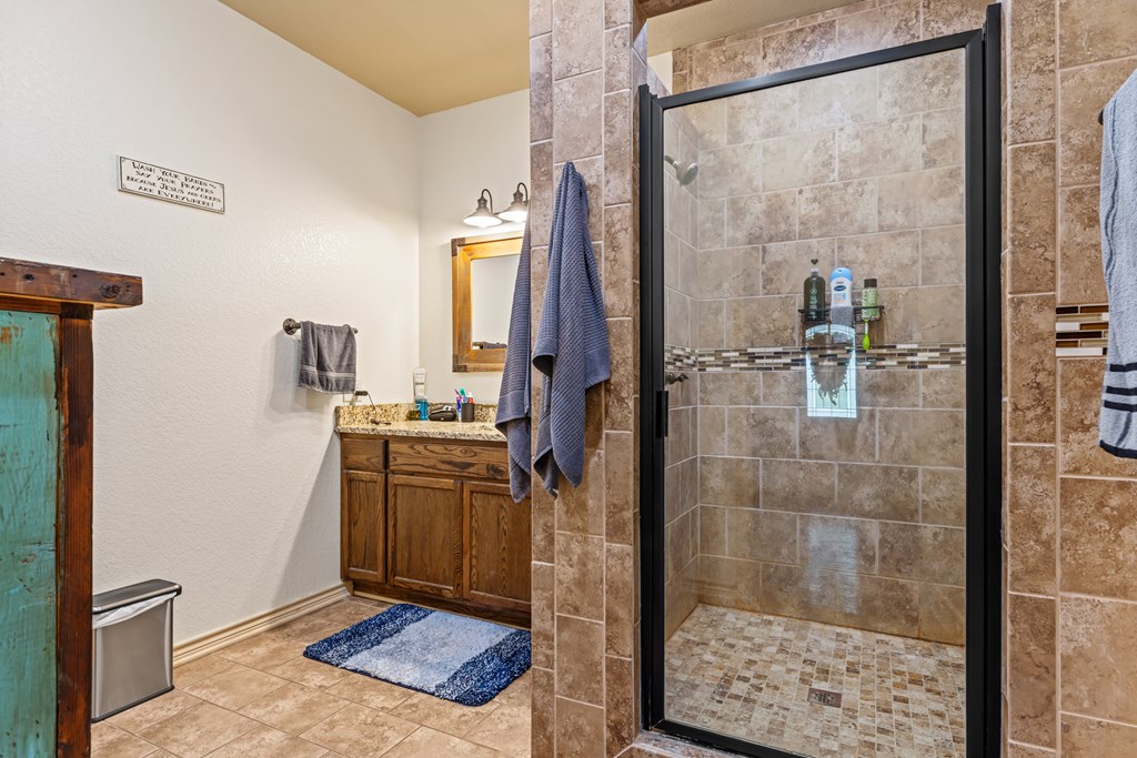221 Coyote Trail Harper, TX 78631 - Photo 12 of 47 a bathroom with a shower