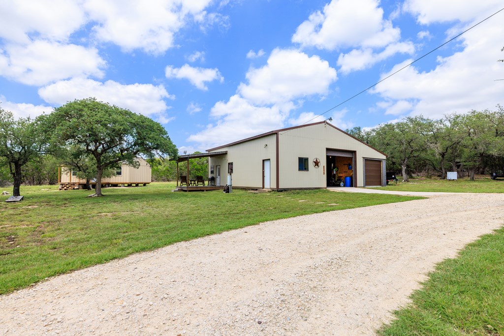 221 Coyote Trail Harper, TX 78631 - Photo 19 of 47 a view of a house with a yard