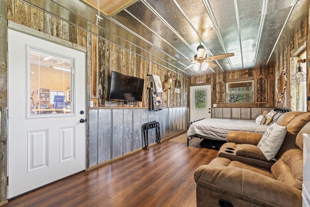 221 Coyote Trail Harper, TX 78631 - Photo 21 of 47 a living room with furniture a flat screen tv and a window