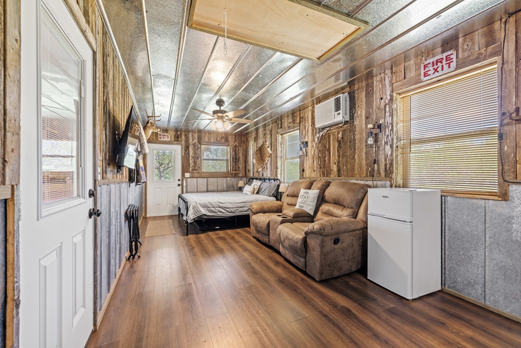 221 Coyote Trail Harper, TX 78631 - Photo 22 of 47 a living room with furniture and a fireplace