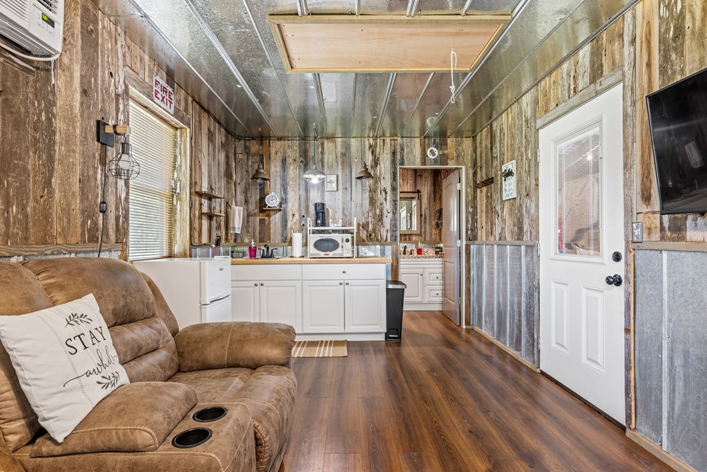 221 Coyote Trail Harper, TX 78631 - Photo 23 of 47 a living room with furniture and a large window