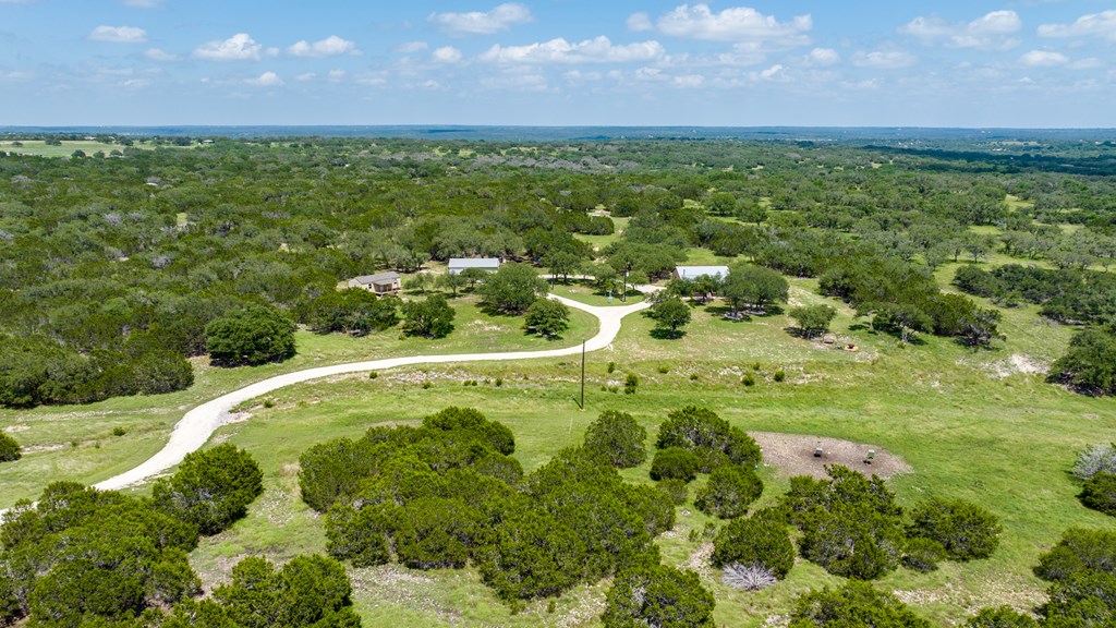 221 Coyote Trail Harper, TX 78631 - Photo 31 of 47 a view of a lush green field