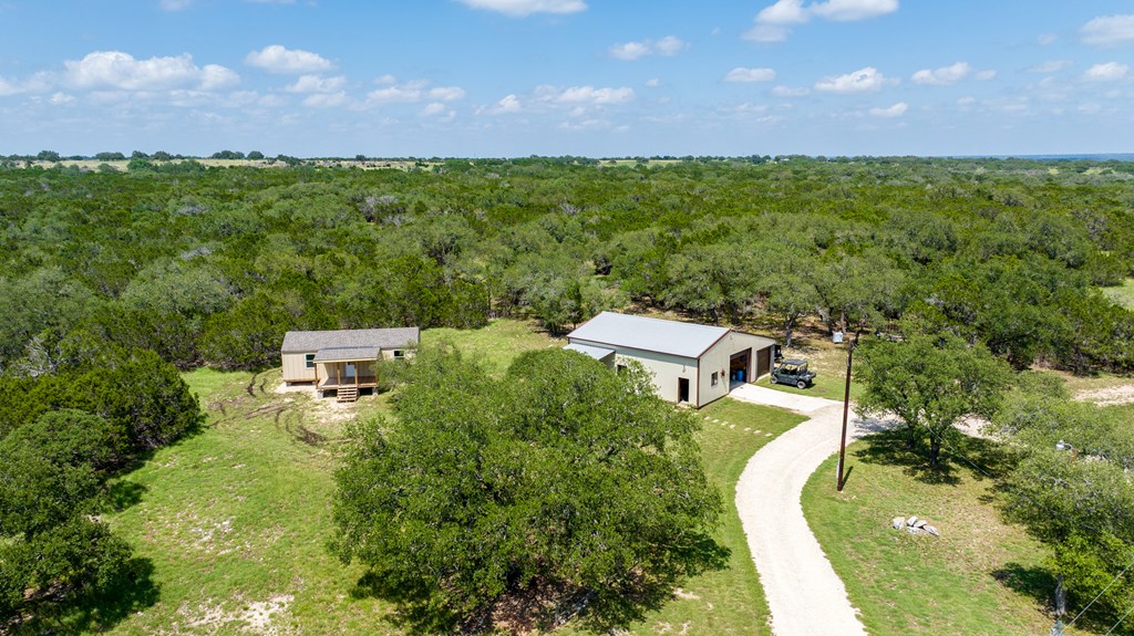 221 Coyote Trail Harper, TX 78631 - Photo 33 of 47 an aerial view of a house with a yard