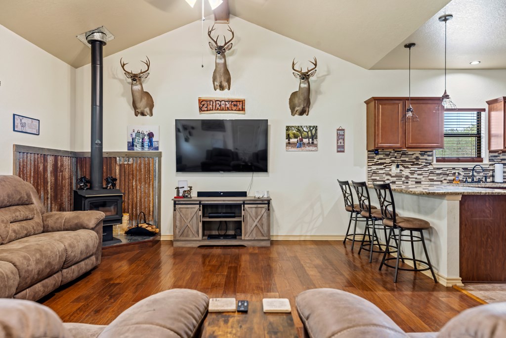 221 Coyote Trail Harper, TX 78631 - Photo 4 of 47 a living room with furniture and a flat screen tv