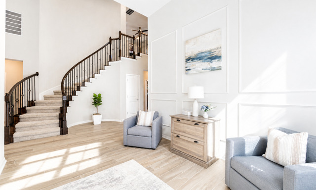1928 Lakeside Ranch Road Georgetown, TX 78633 - Photo 25 of 37 Grand curved staircase and light wood-tone flooring create an inviting entryway.