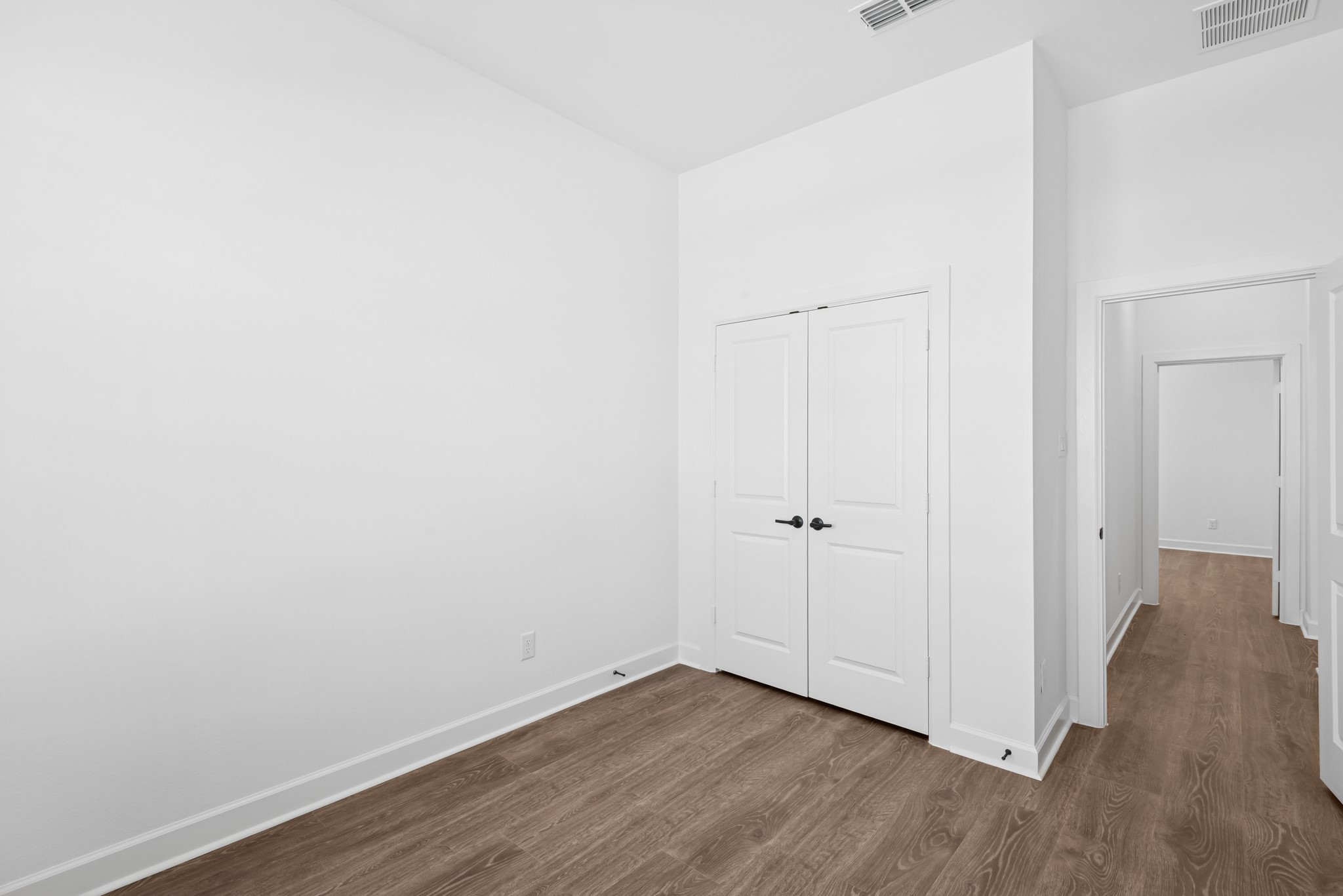 5510 Orangery Lane Manvel, TX 77578 - Photo 14 of 48 a view of an empty room with wooden floor