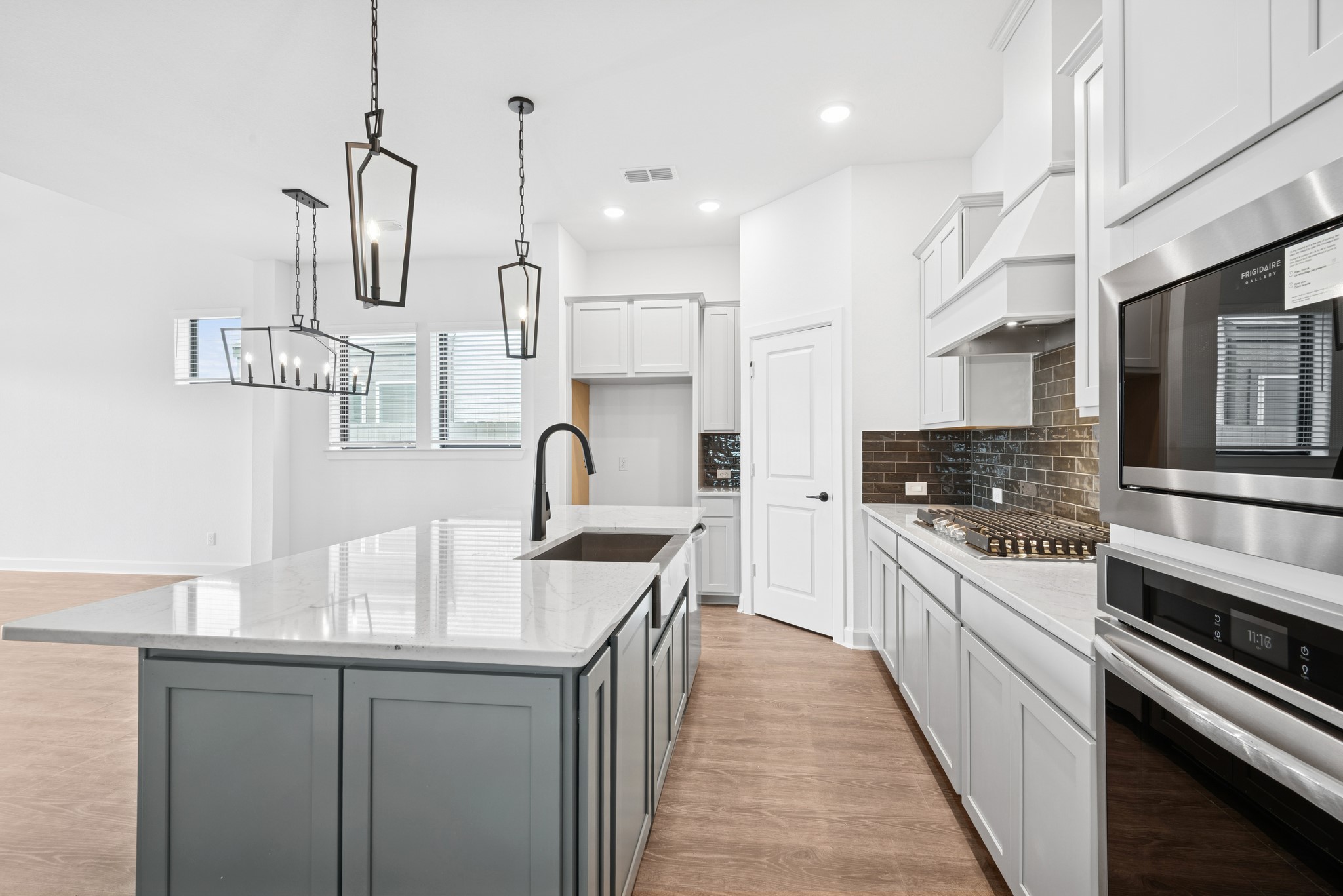 5510 Orangery Lane Manvel, TX 77578 - Photo 21 of 48 a kitchen with stainless steel appliances granite countertop a sink stove and refrigerator