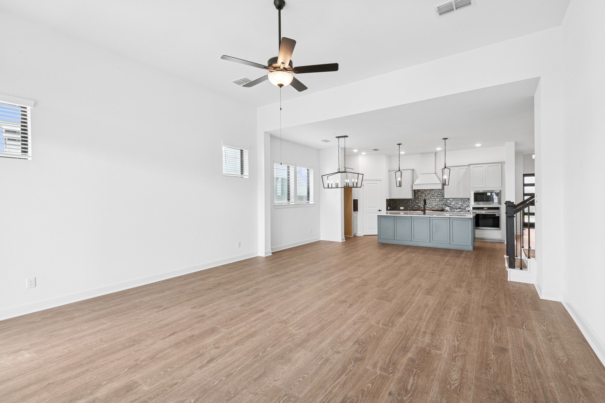 5510 Orangery Lane Manvel, TX 77578 - Photo 28 of 48 a view of a kitchen with a sink and a refrigerator