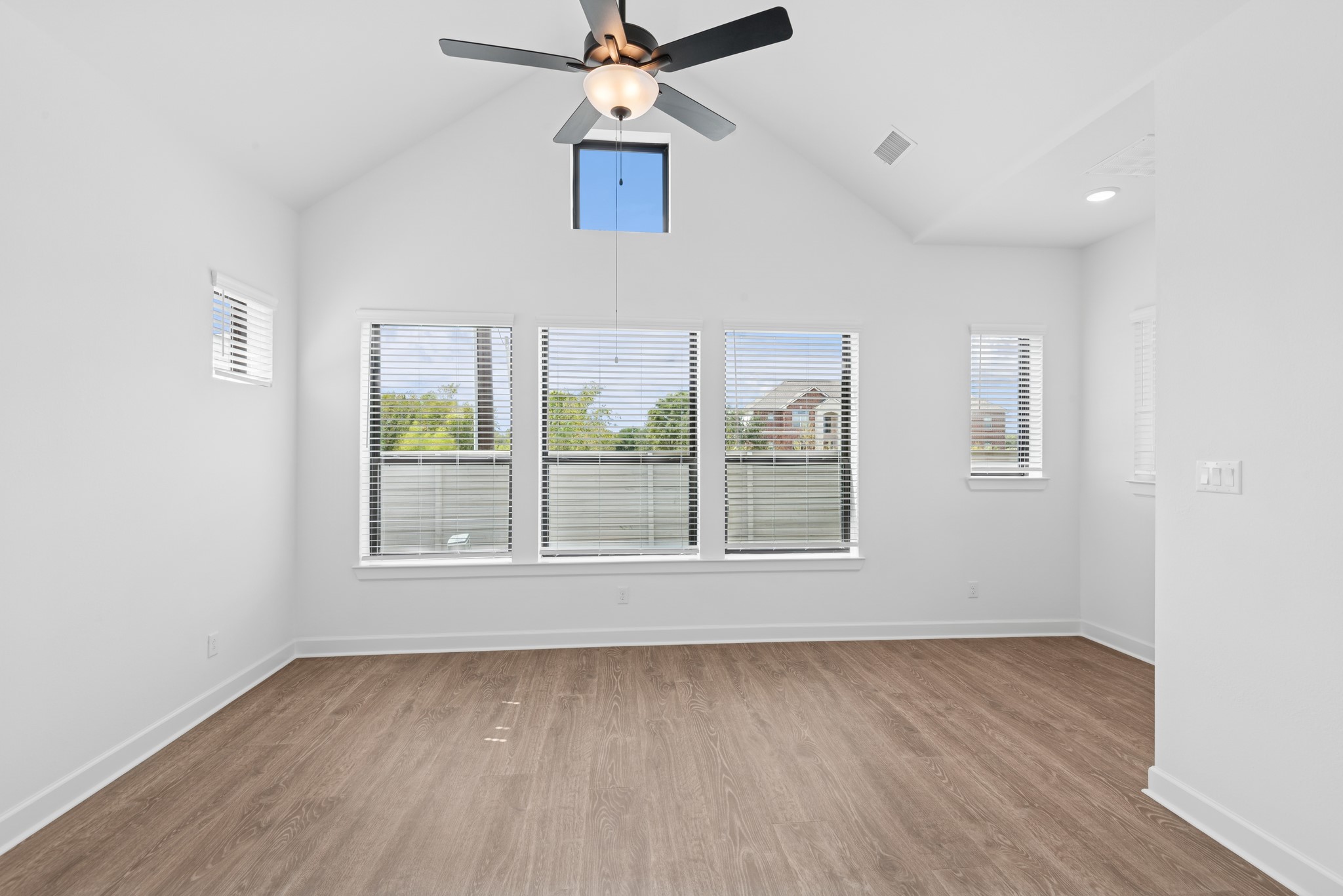 5510 Orangery Lane Manvel, TX 77578 - Photo 30 of 48 an empty room with wooden floor fan and windows