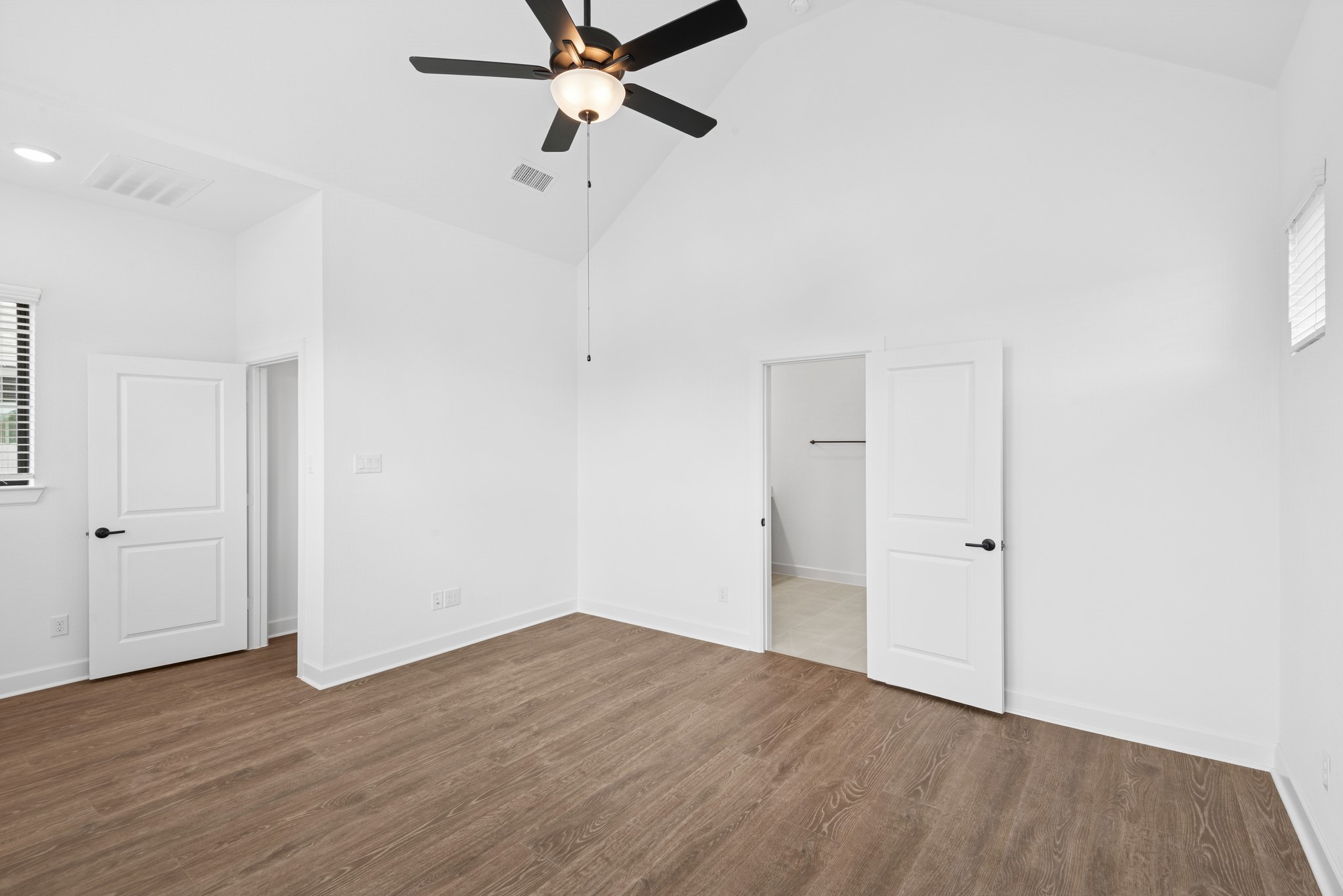 5510 Orangery Lane Manvel, TX 77578 - Photo 31 of 48 an empty room with wooden floor fan and windows