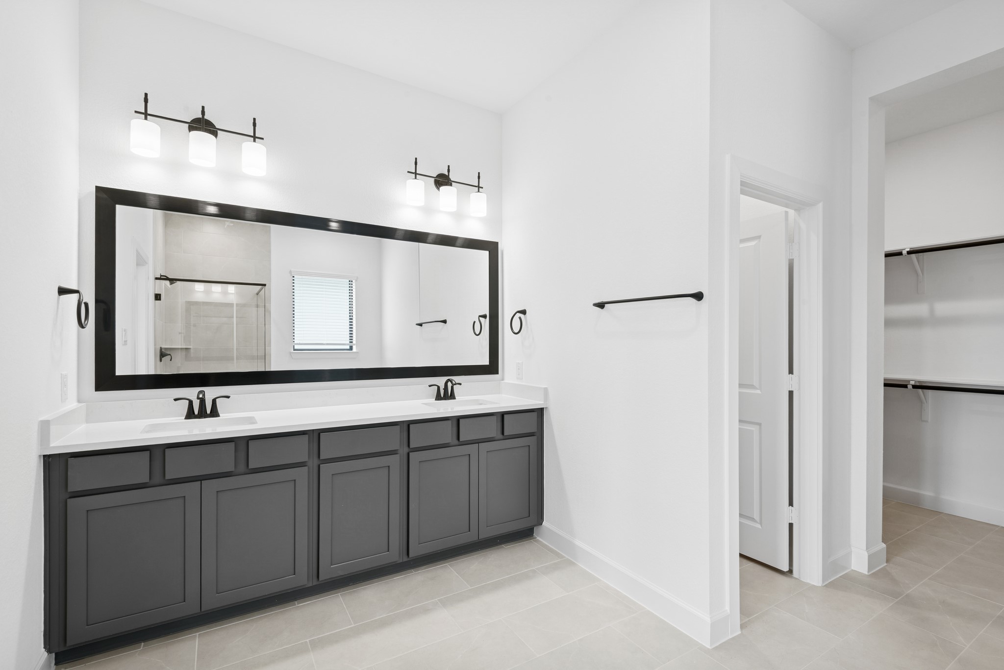 5510 Orangery Lane Manvel, TX 77578 - Photo 34 of 48 a bathroom with a double vanity sink mirror and