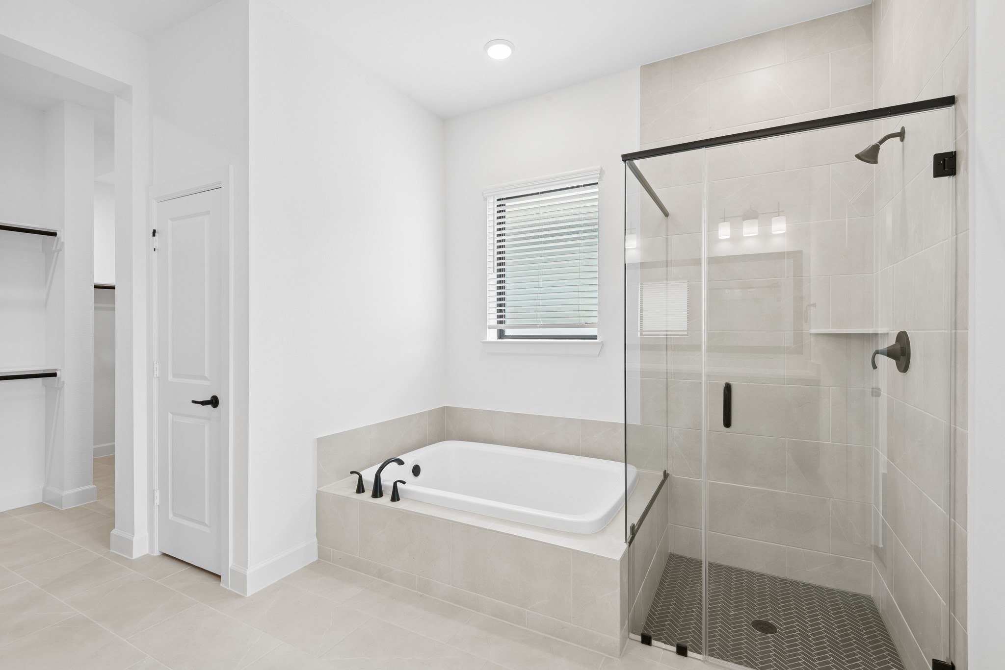 5510 Orangery Lane Manvel, TX 77578 - Photo 35 of 48 a bathroom with a bathtub and a shower