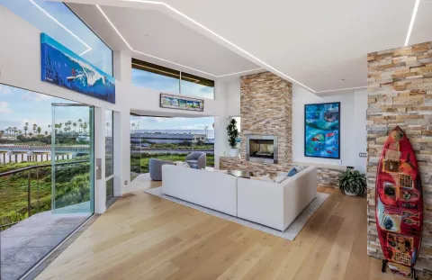 a living room with furniture a fireplace and a flat tv screen