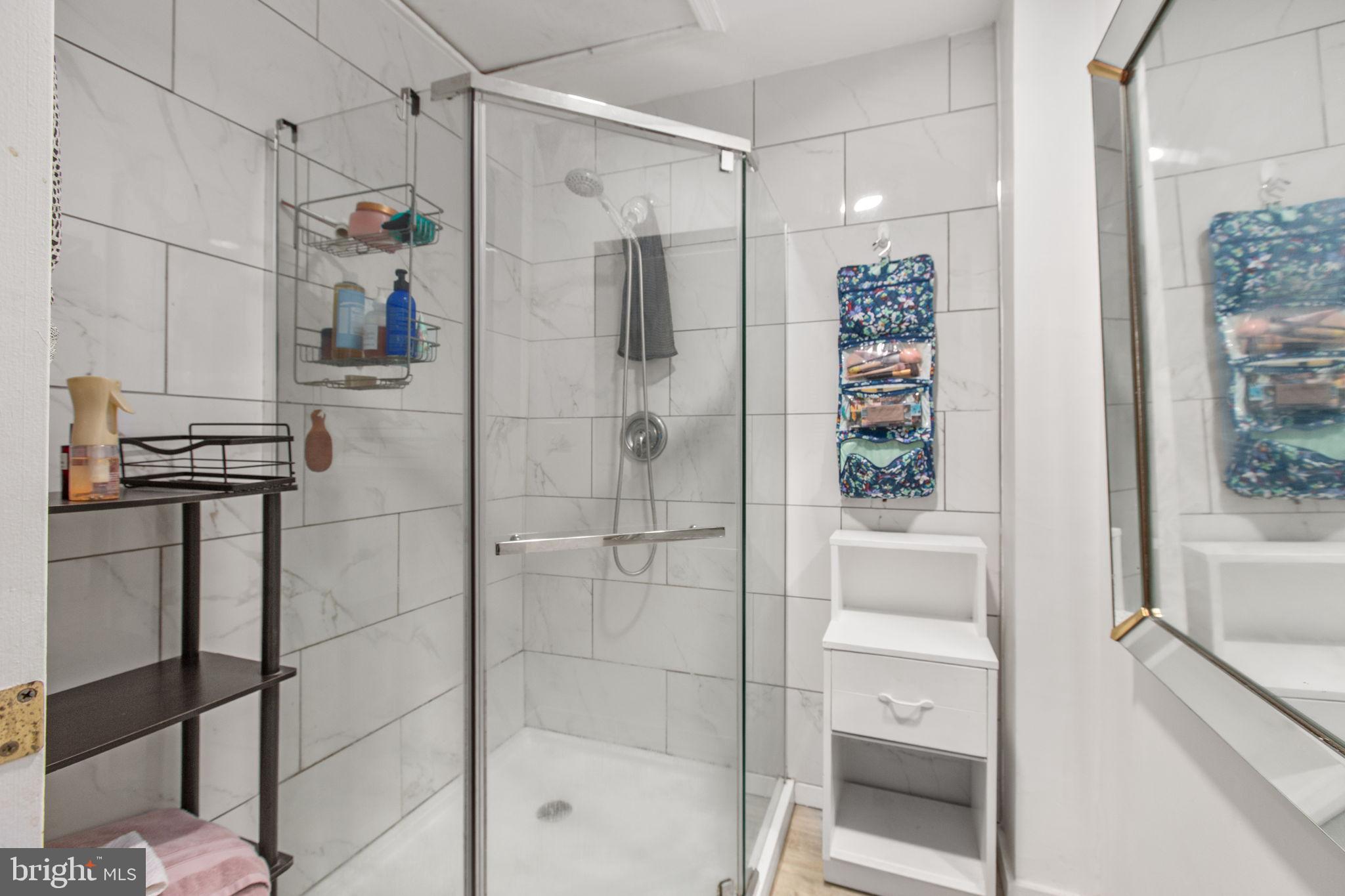 809 Caroline Street Fredericksburg, VA 22401 - Photo 11 of 12 Shower with glass enclosure.