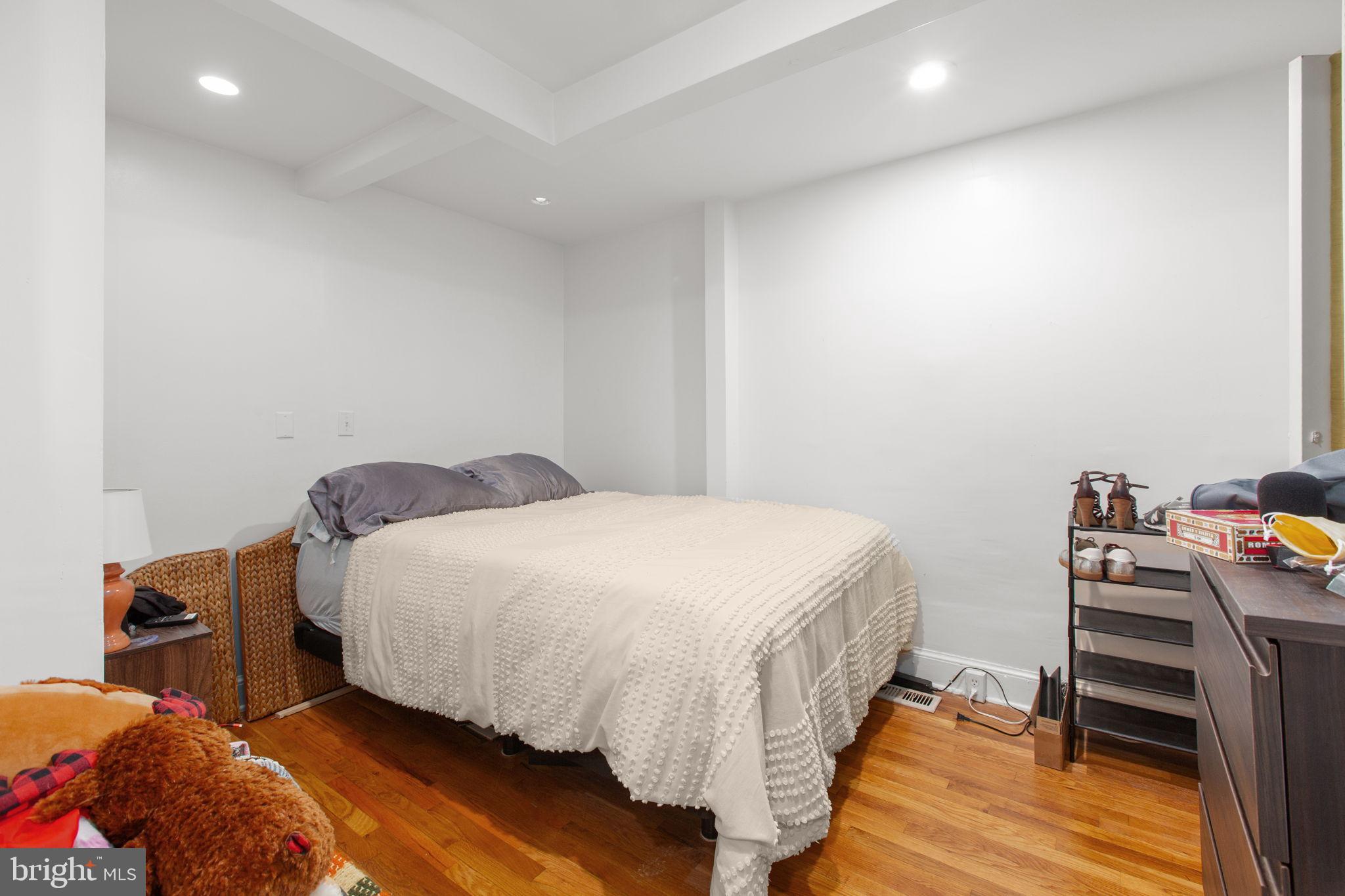 809 Caroline Street Fredericksburg, VA 22401 - Photo 7 of 12 Interior bedroom with warm wooden floors.