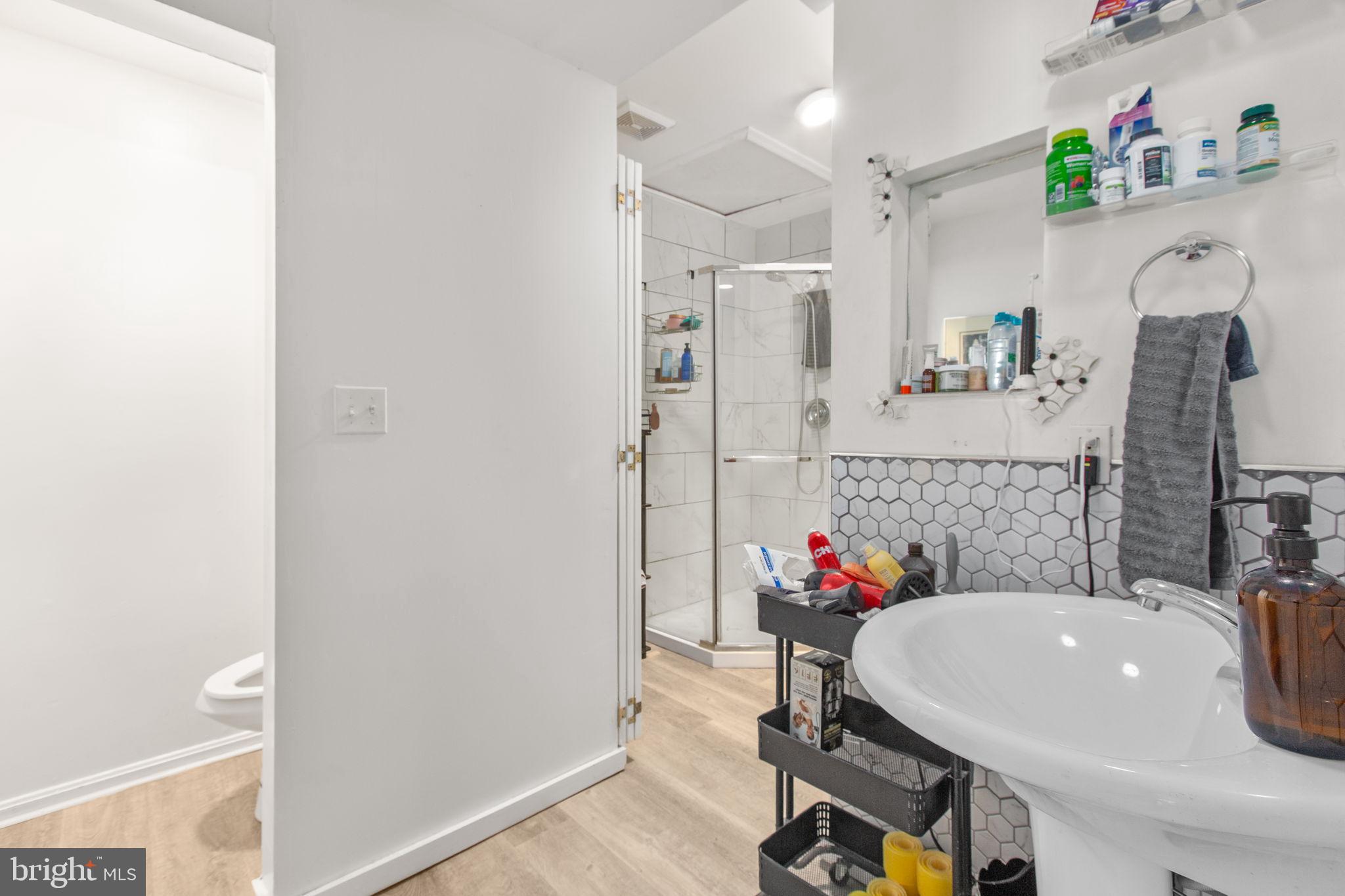 809 Caroline Street Fredericksburg, VA 22401 - Photo 10 of 12 Spacious bathroom with separate design elements.
