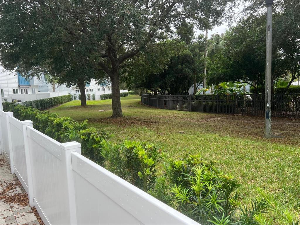 7770 Sandy Ridge Drive, Unit 126 Reunion, FL 34747 - Photo 12 of 33 a view of a garden with trees
