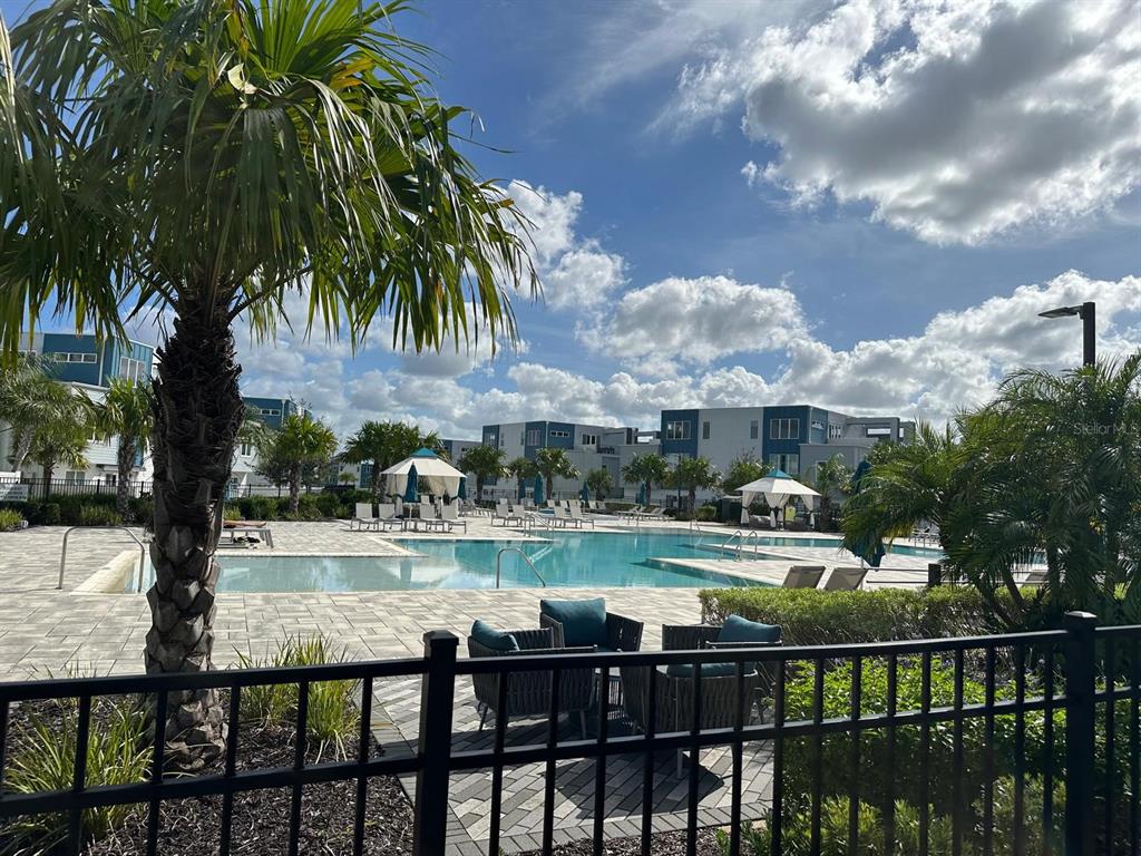 7770 Sandy Ridge Drive, Unit 126 Reunion, FL 34747 - Photo 17 of 33 a view of swimming pool from a lake