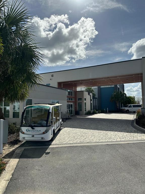7770 Sandy Ridge Drive, Unit 126 Reunion, FL 34747 - Photo 19 of 33 a view of a car parked in back of a house
