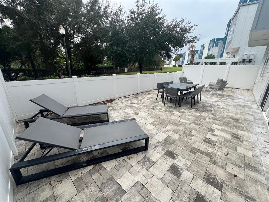 7770 Sandy Ridge Drive, Unit 126 Reunion, FL 34747 - Photo 10 of 33 a view of a terrace with chairs and couches