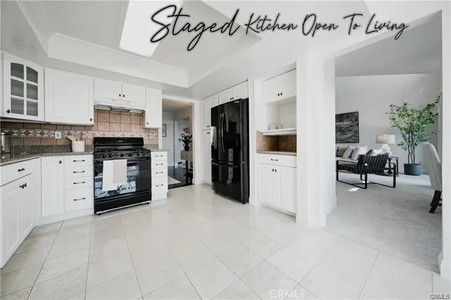 a kitchen with cabinets and window